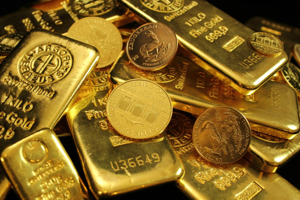 India Hikes Import Duties on Gold and Silver Back to 15%: What It Means for Consumers and the Economy Detailed close-up of gold bars and coins, symbolizing wealth and investment. Perfect for financial imagery.